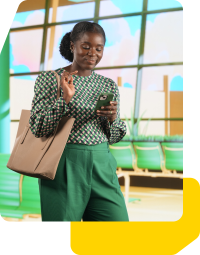 A women holding a cellphone smiling.